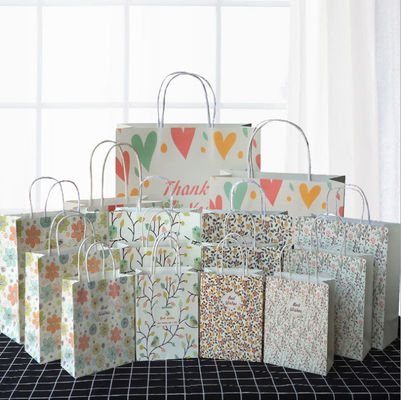 Starke tragende aufbereitete Papiertüten mit Griff-Jahrestag Kraftpapier nehmen Taschen heraus